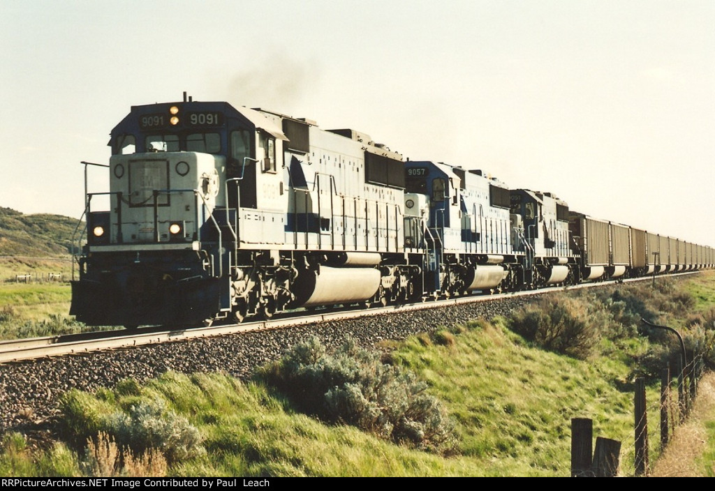 Loaded coal train rolls east